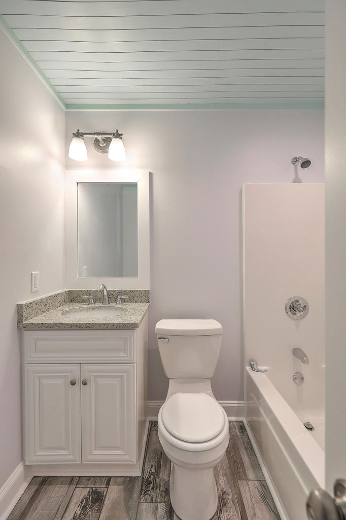 View of the bathroom with white cabinet
