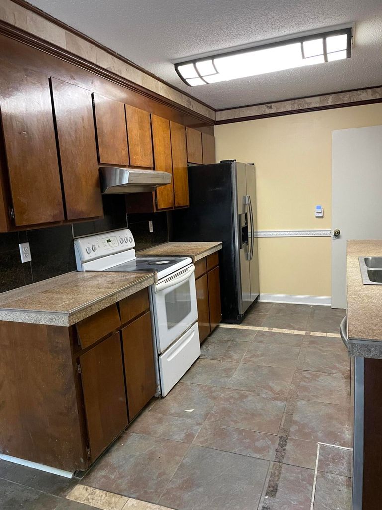 View of the kitchen with wooden cabinets