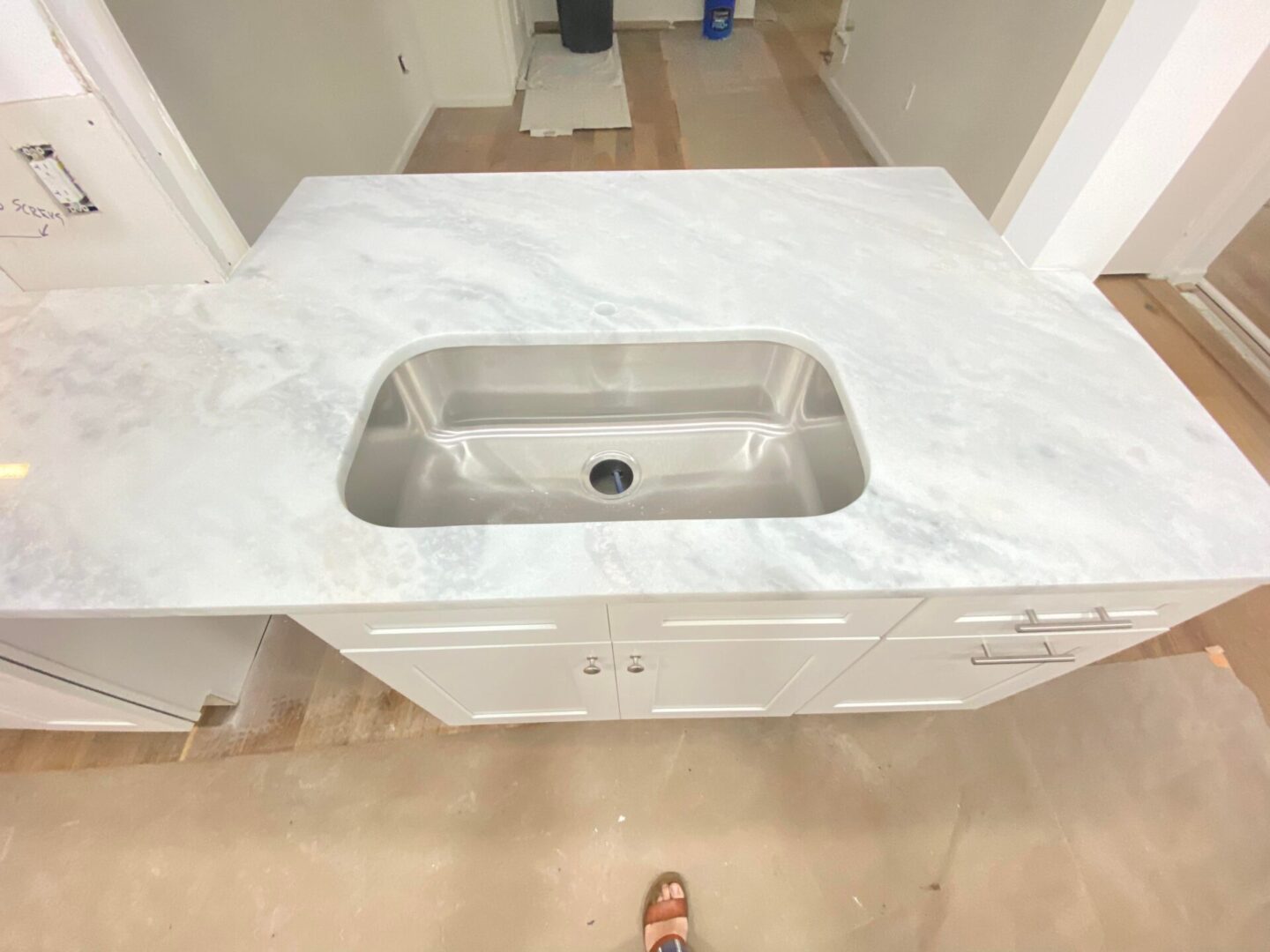 Closeup shot of kitchen sink with white platform