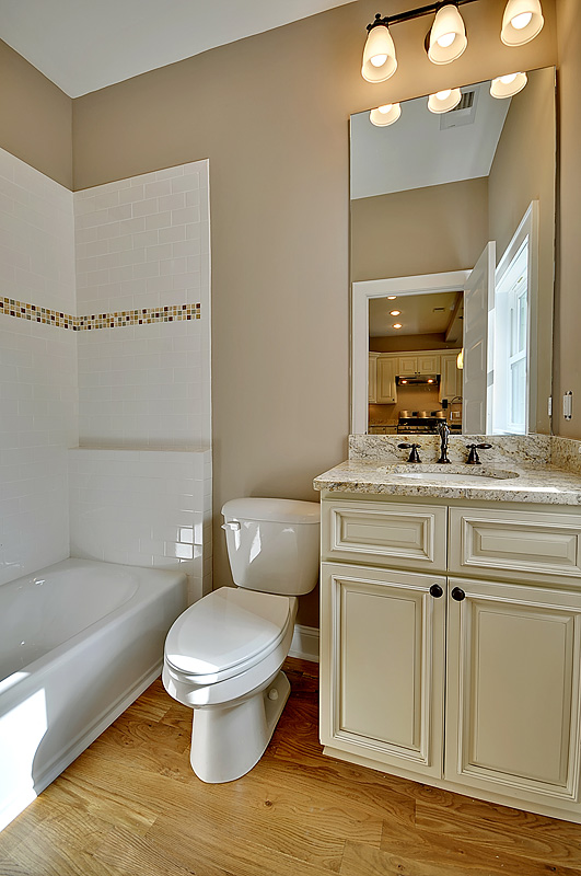 A view at the modern bathroom with wooden flooring